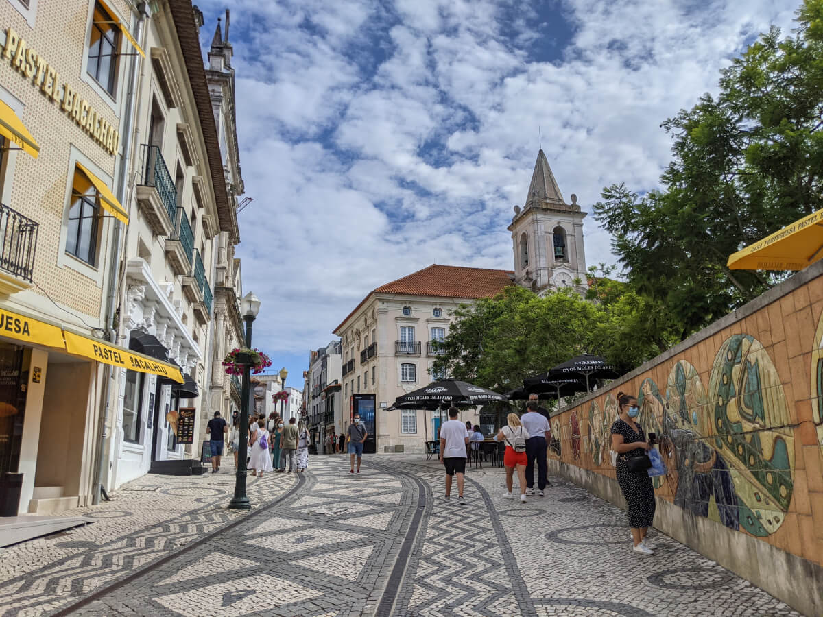 Image: The photo shows tourists on a warm, partly cloudy September day in downtown Aveiro in central Portugal.