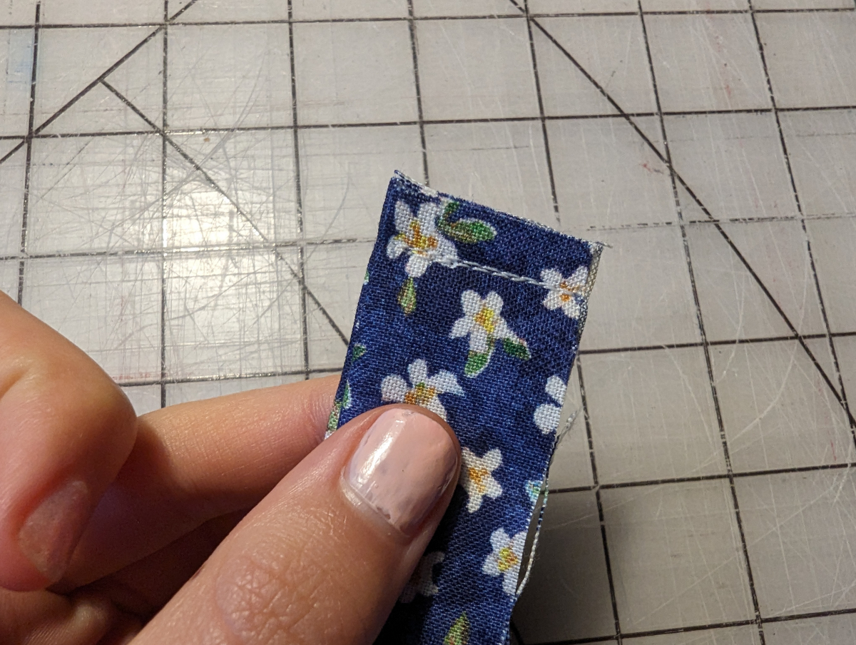 Binding piece sewn at one end