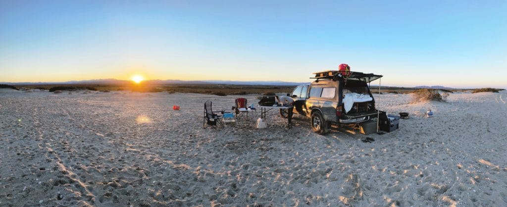 sunset with truck setup for camping
